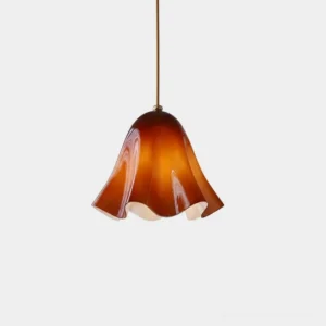 Vera amber glass wavy pendant light close-up studio shot showing hand-finished sculptural shade details