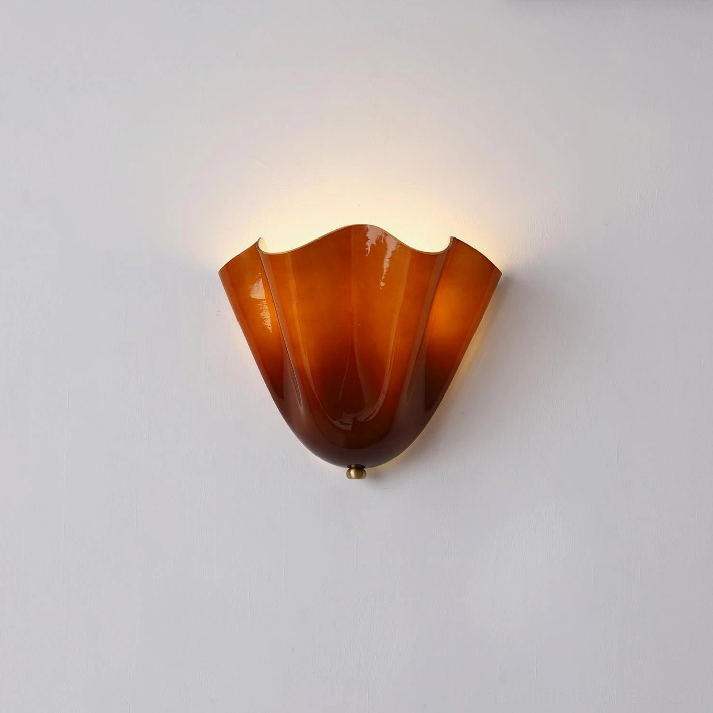 Vera amber glass wall sconce close-up showing metal hardware connection and fixture base detail