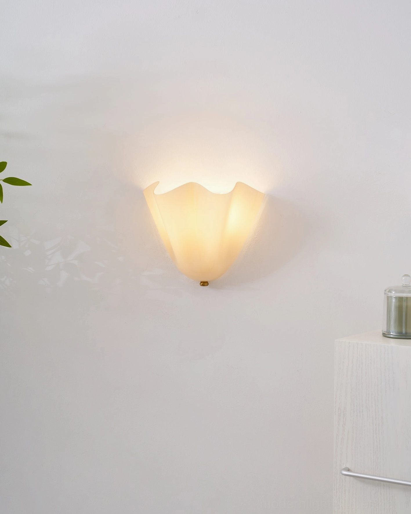 Vera amber glass wall sconce providing vintage bistro-style warm luminous quality in dining space