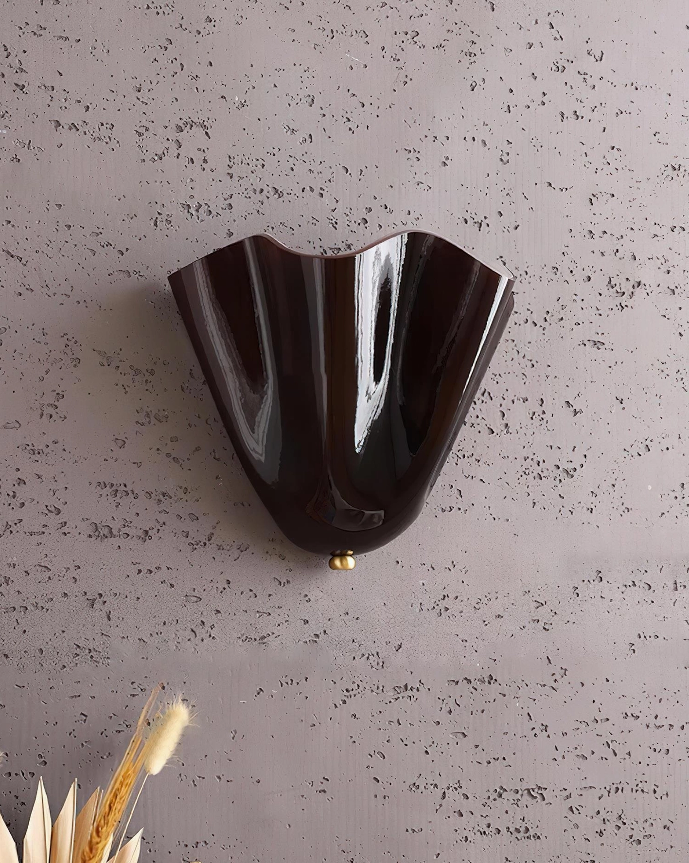 Vera brown glass wall sconce paired with natural wood furnishings in contemporary organic interior