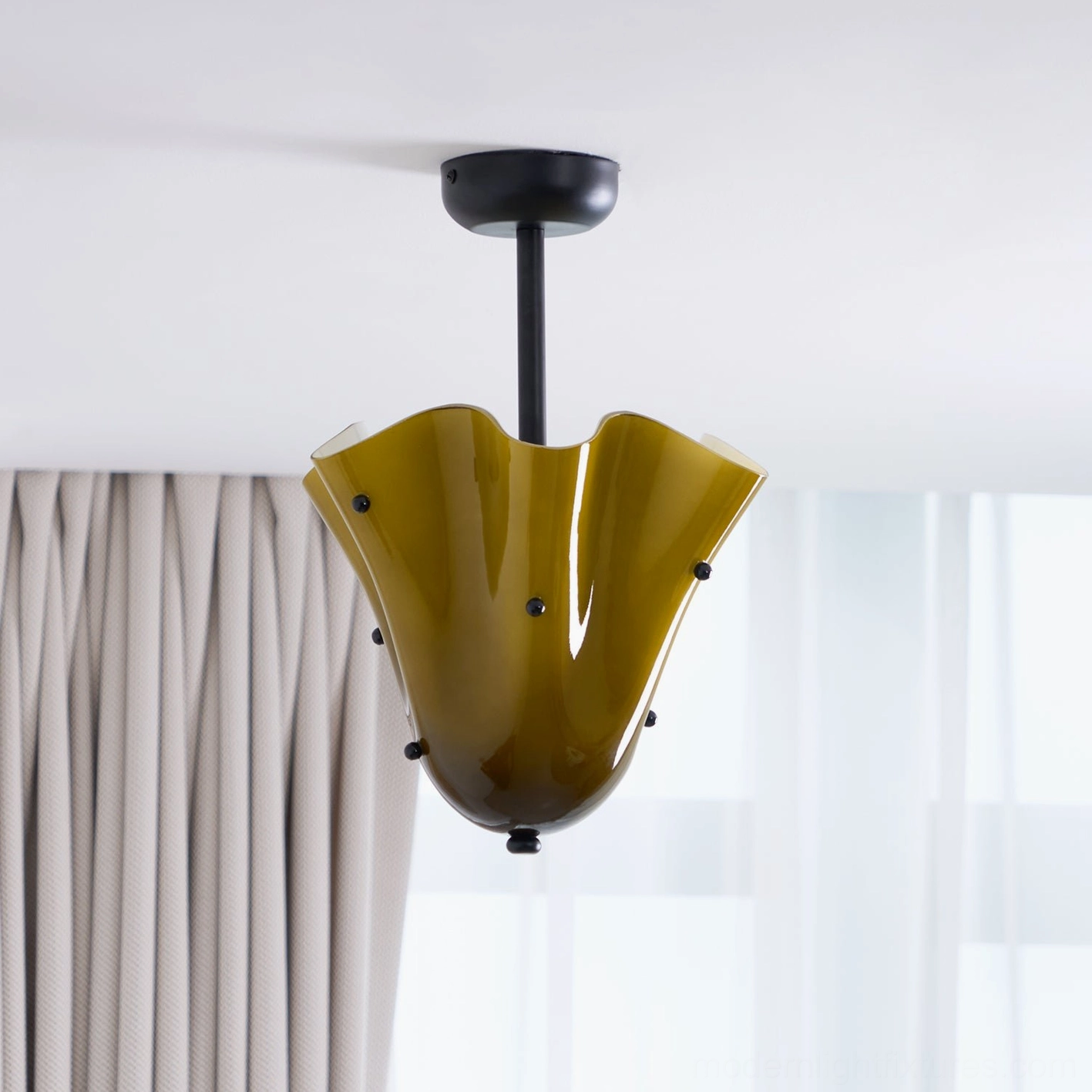Vera modern ceiling light fixture showing organic petal-like glass shape and metal mounting