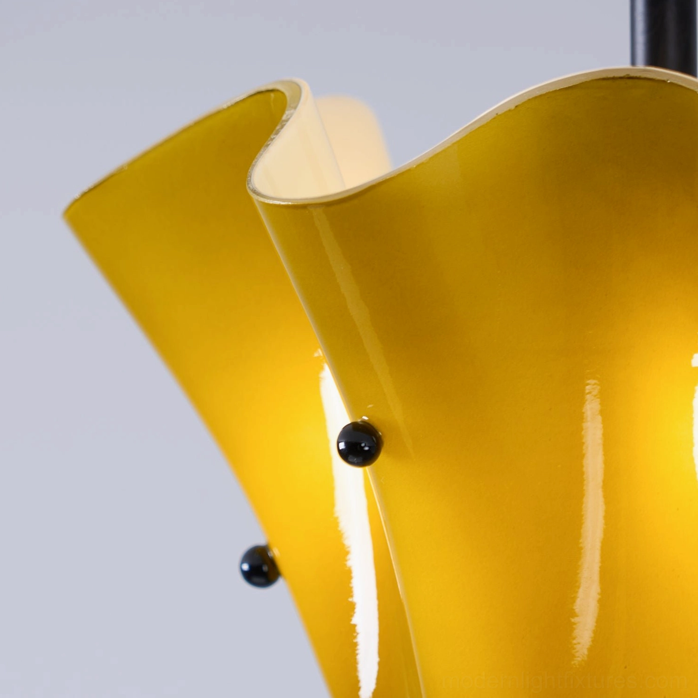 Vera semi-flush ceiling light highlighting fluid glass silhouette and decorative metal studs
