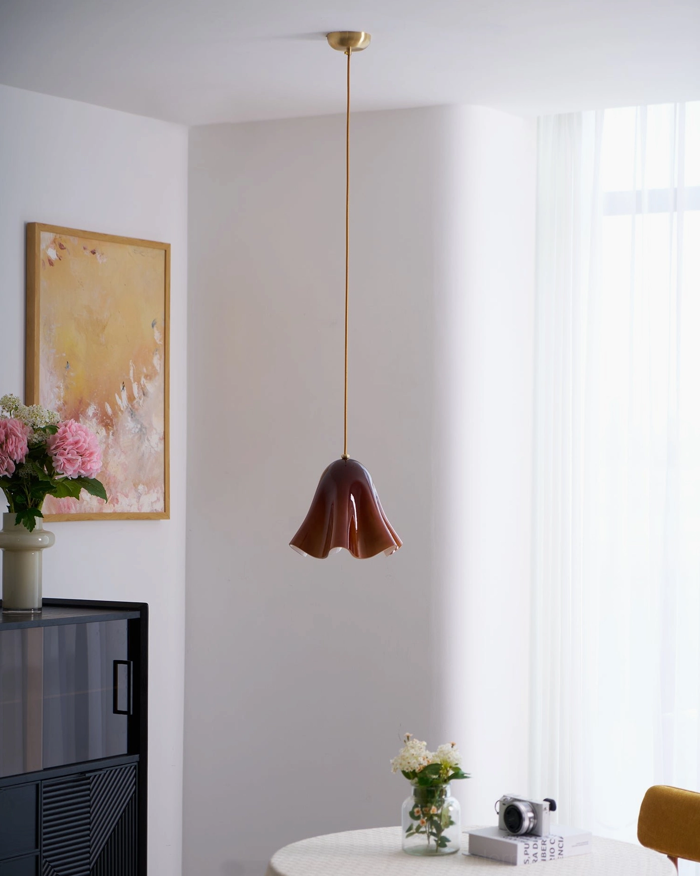 Vera glass pendant light in luxury hotel lobby setting as designer statement fixture