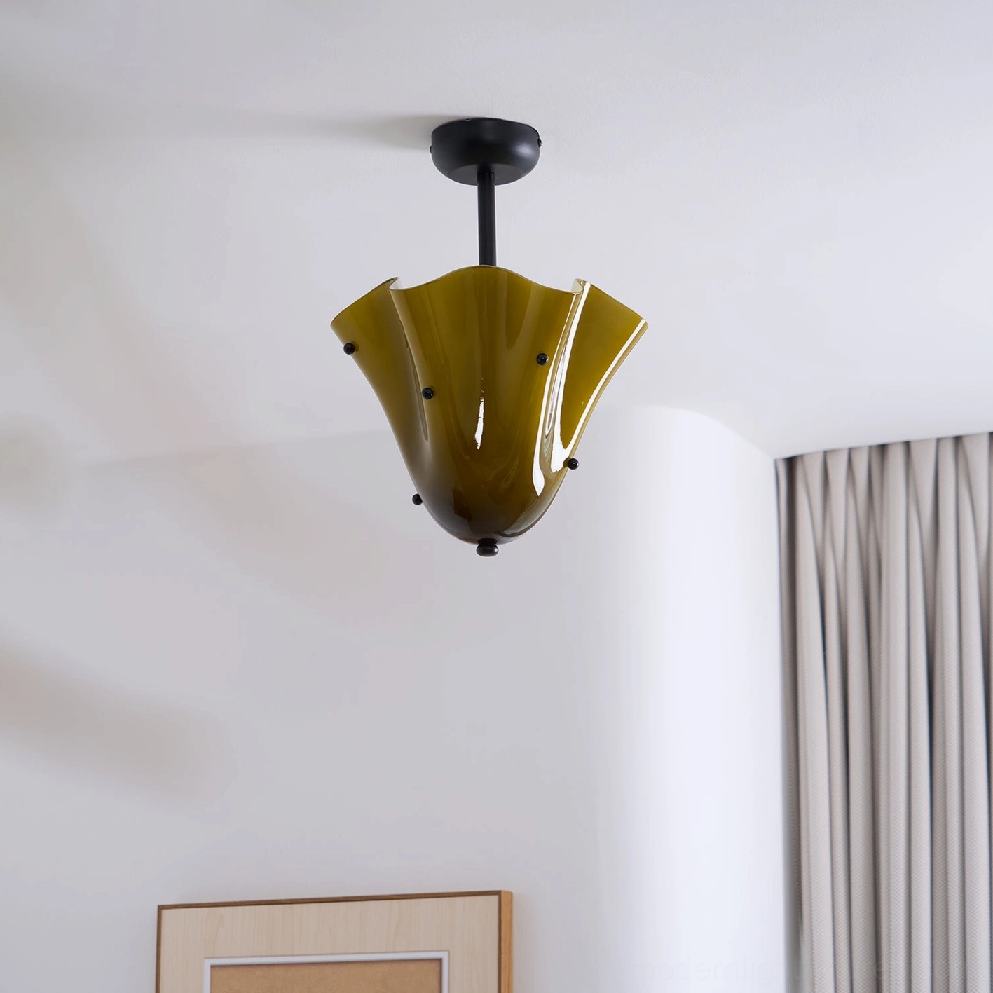 Vera ceiling light with gold canopy and ruffled glass shade creating sculptural impact