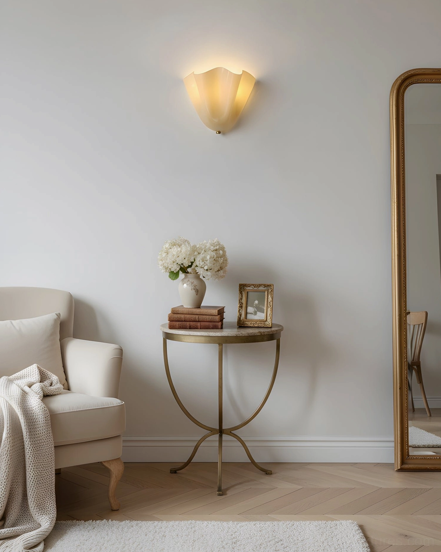 Vera green hand-blown glass wall sconce showing jewel-tone translucent color and sculptural form