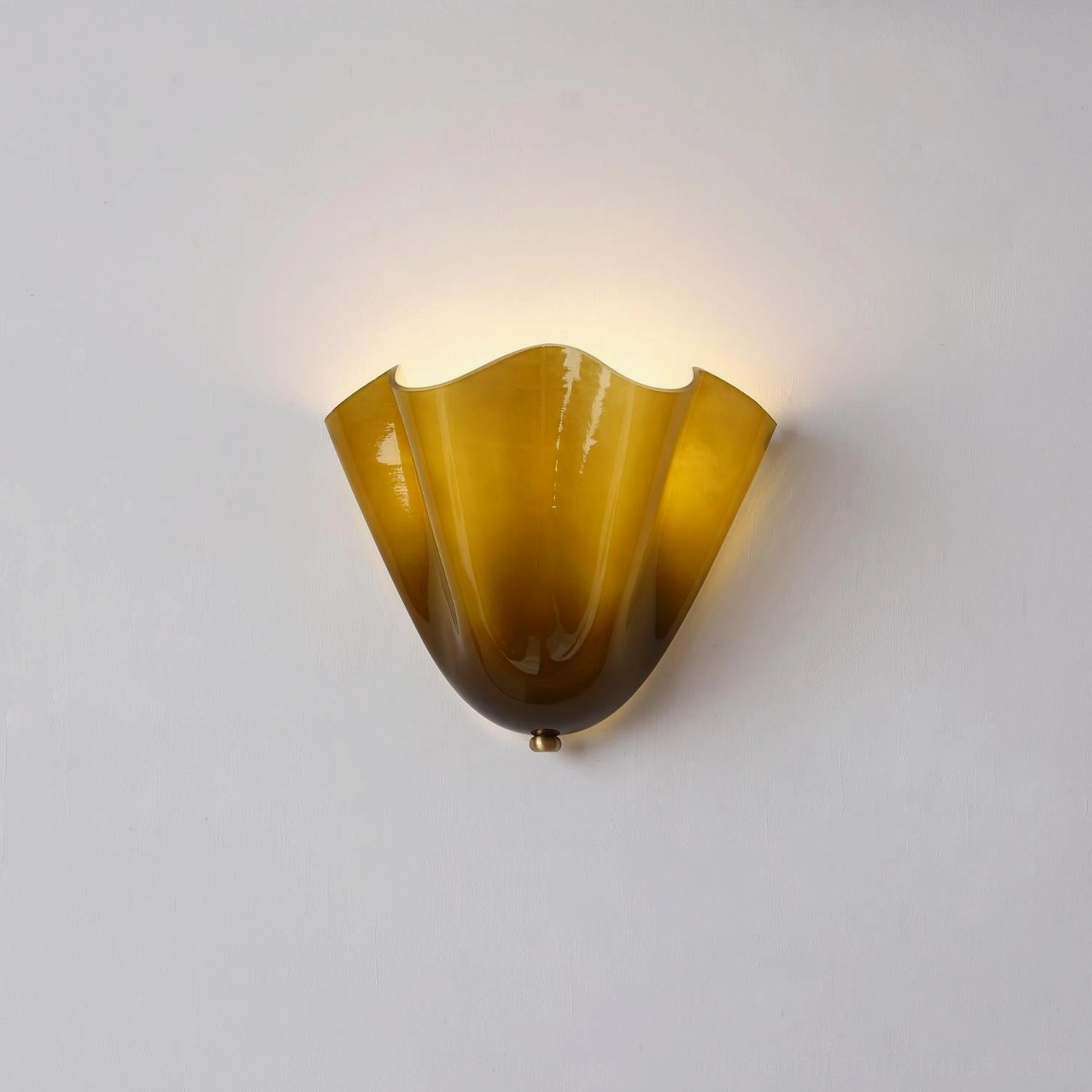 Vera green hand-blown glass wall sconce showing art deco inspired jewel-tone glass coloring