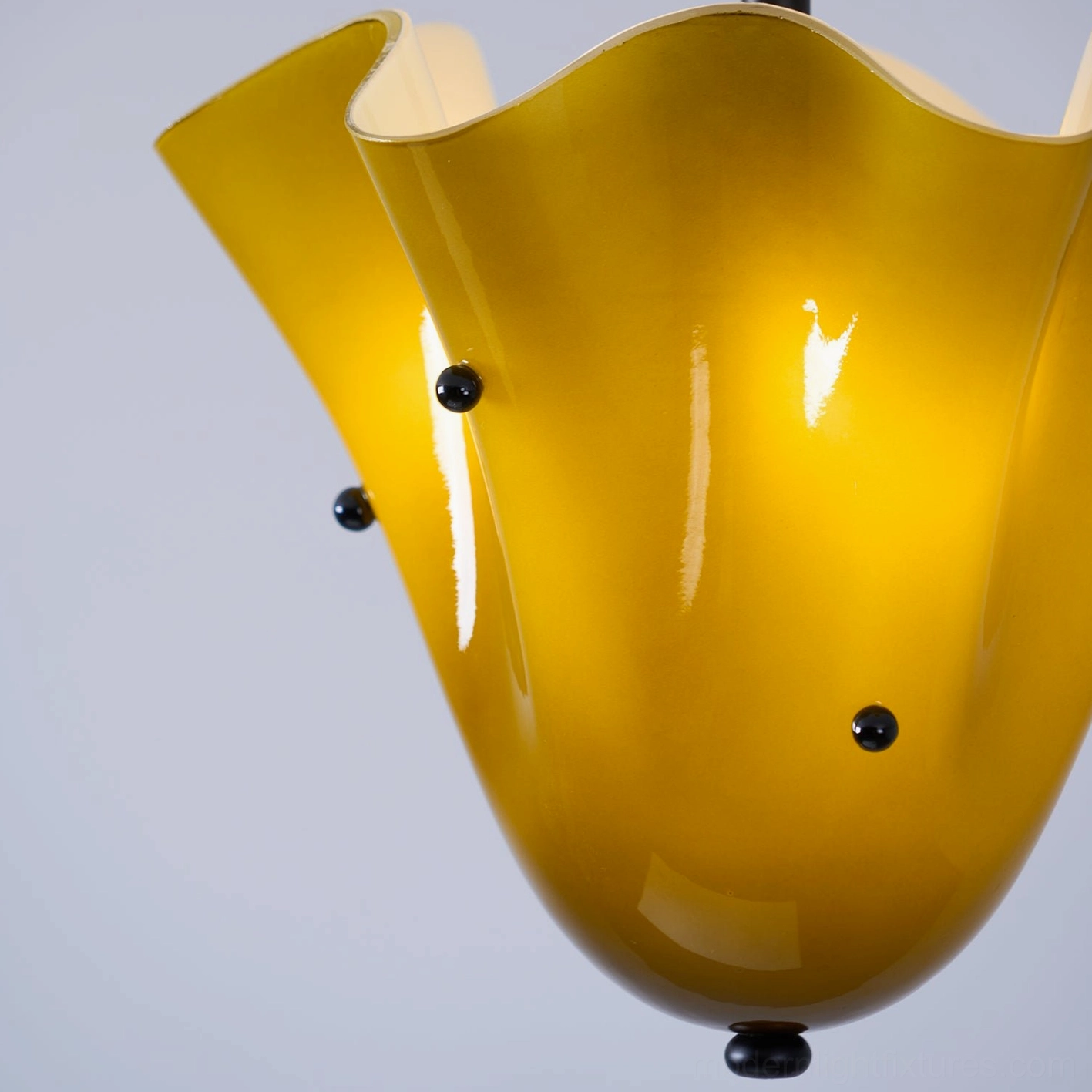 Vera ceiling light showcasing hand-crafted ruffled glass and premium metal finish options