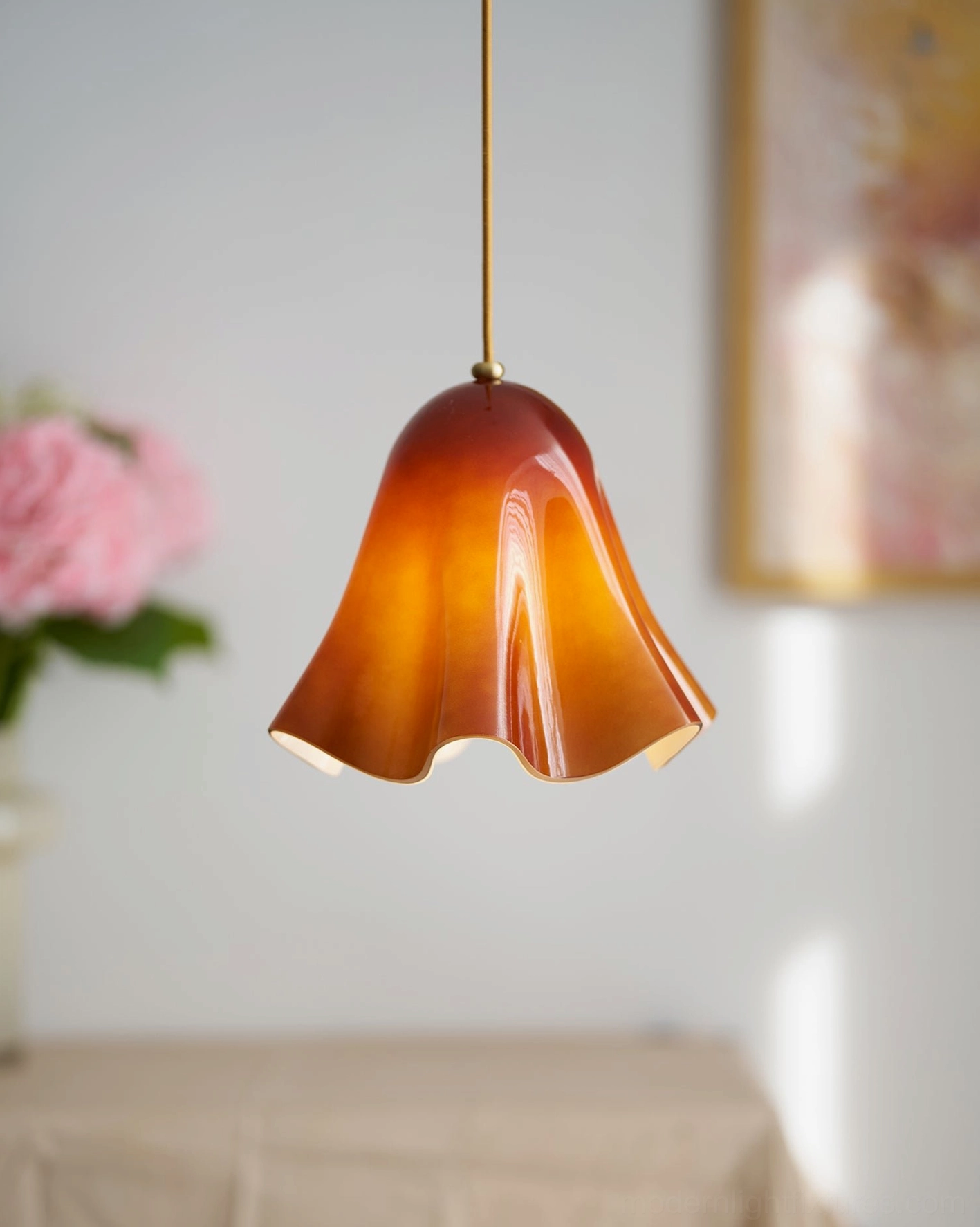 Vera handcrafted glass pendant light providing ambient illumination in contemporary living space