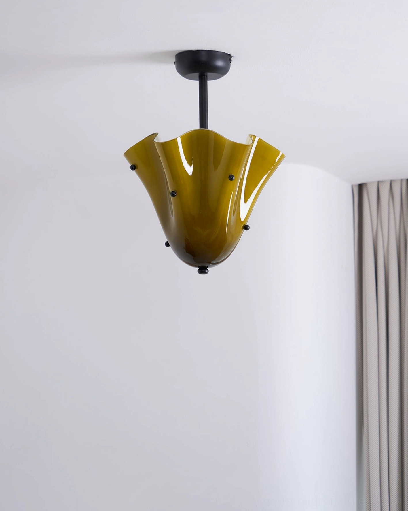 Dark olive green sculptural vera ceiling light mounted in contemporary gray bedroom