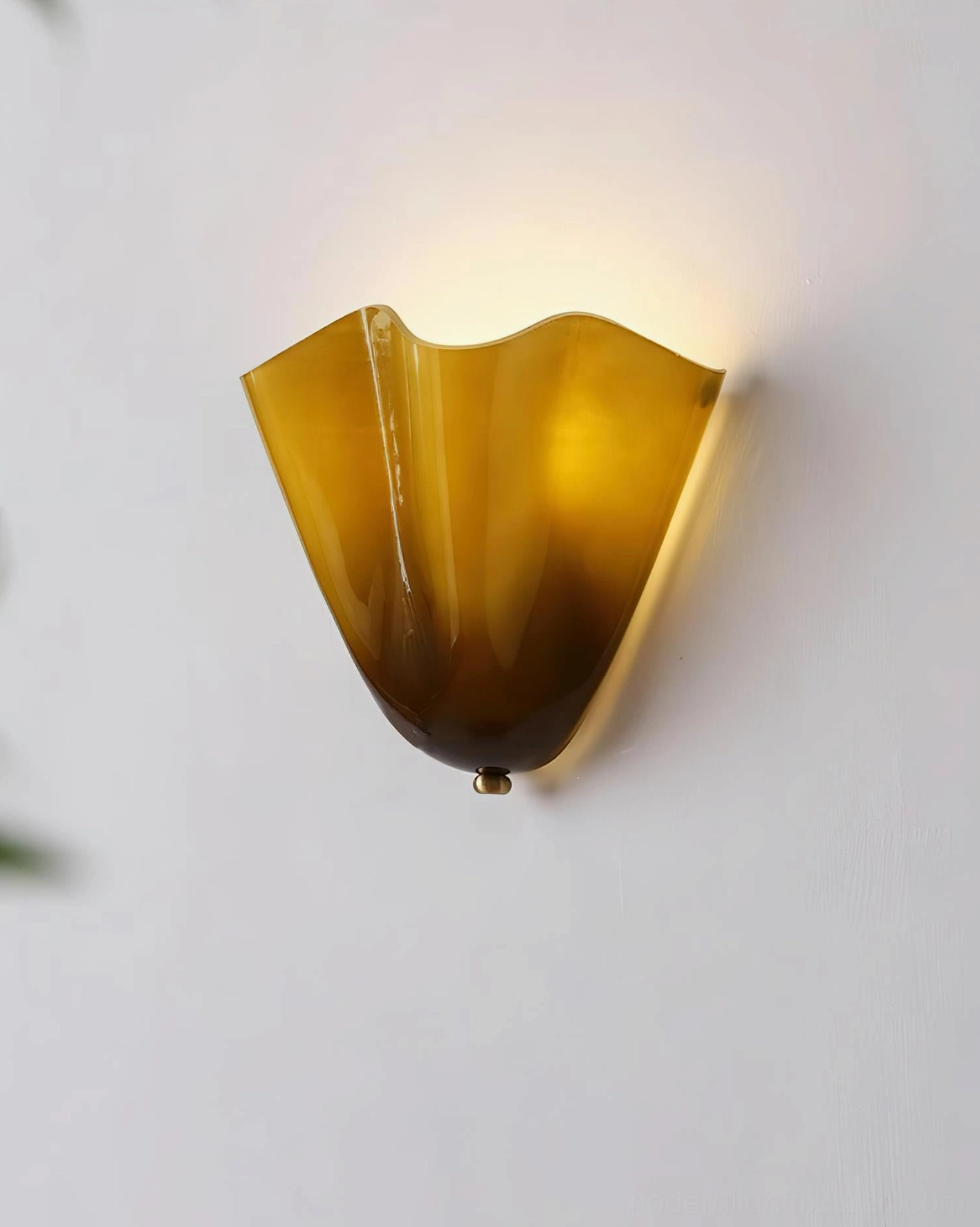Vera wall sconce providing subtle accent lighting in contemporary living room with neutral palette