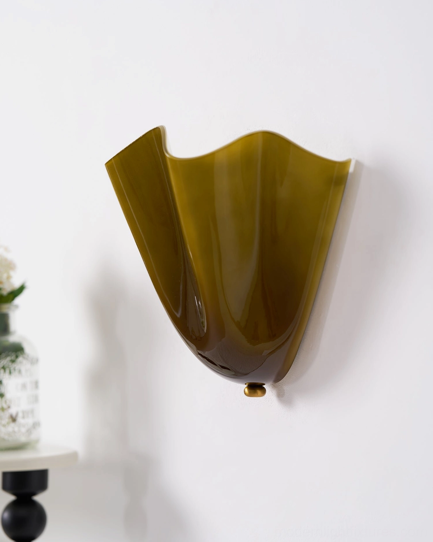 Vera hand-blown glass wall sconce mounted in entryway console space creating welcoming focal point