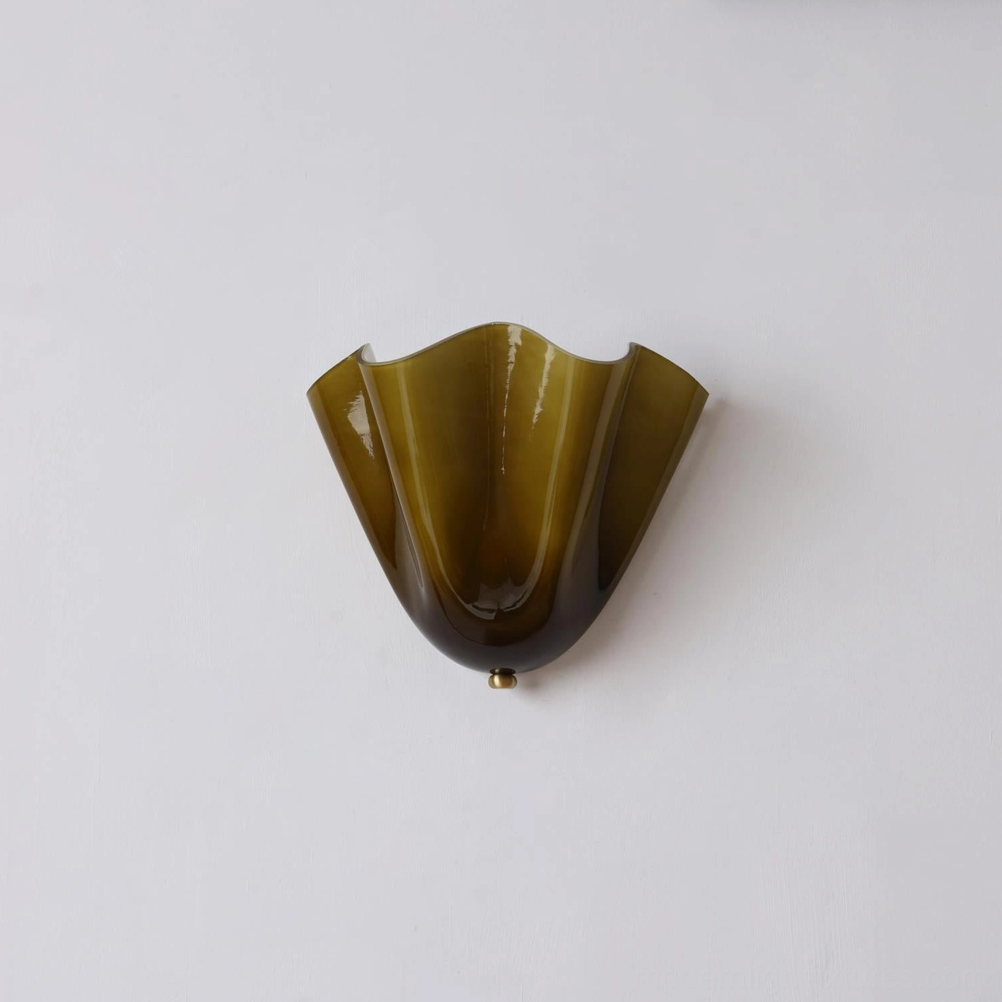 Vera wall sconce installation showing proper eye-level mounting height for bedroom or bathroom use