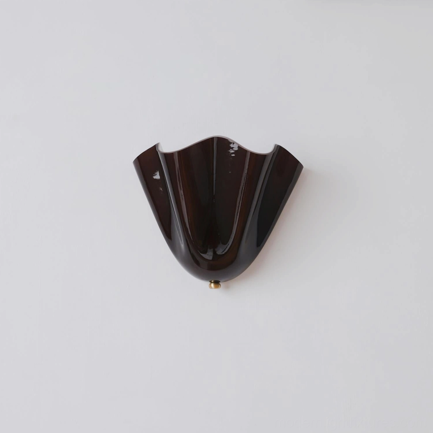 Vera wall sconce mounted on feature wall creating architectural focal point and accent lighting effect