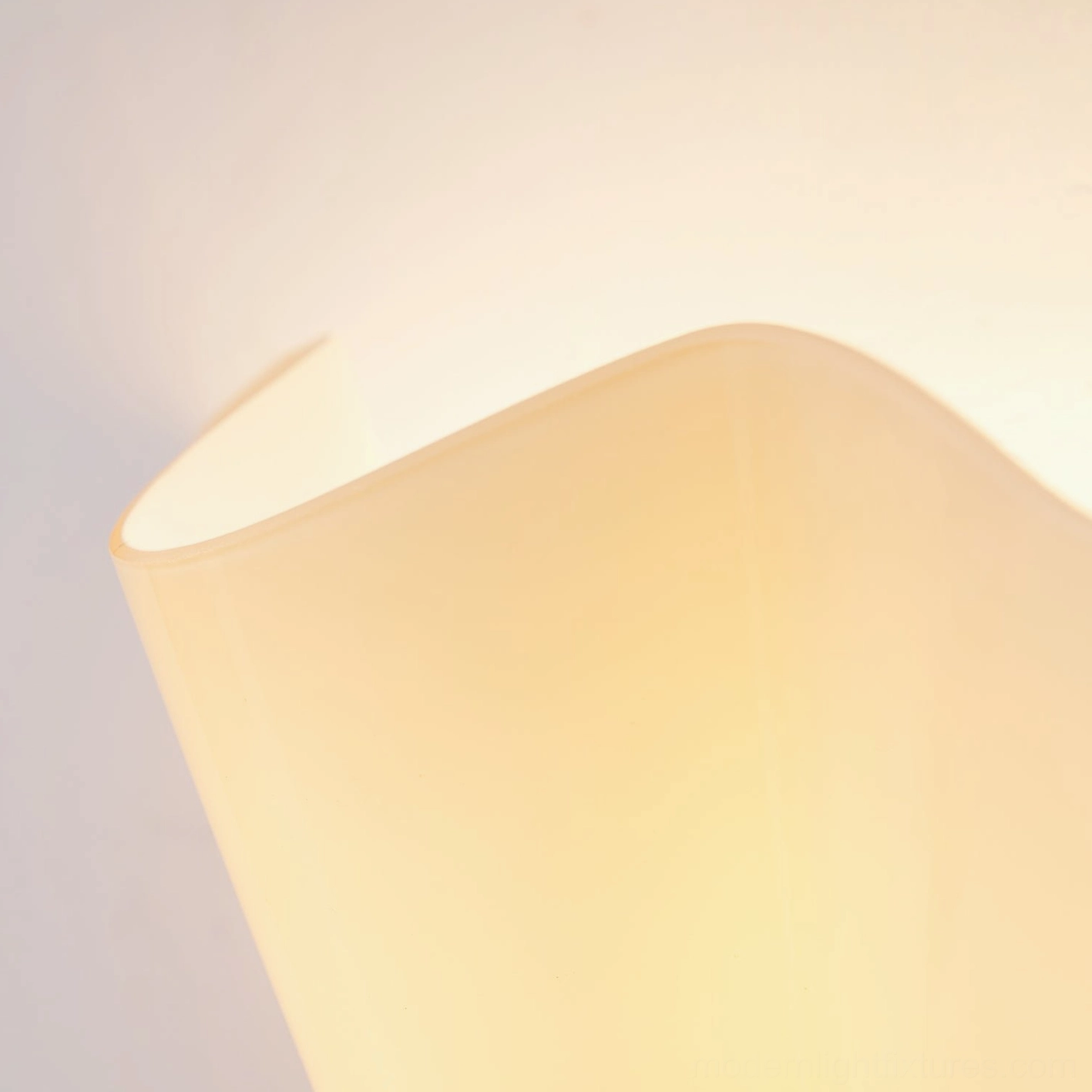 Vera wall sconce mounted in minimalist bedroom providing functional task and ambient light