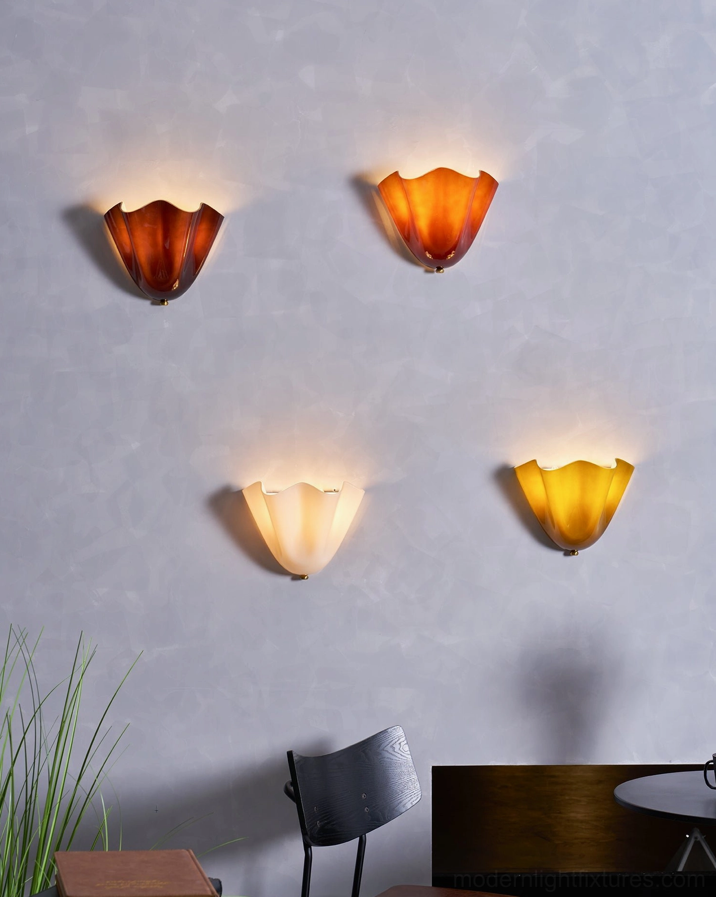 Vera wall sconce mounted in contemporary minimalist interior showing sculptural glass art form