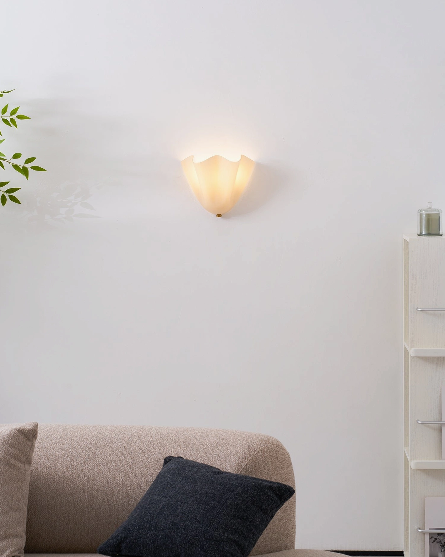 Pair of Vera wall sconces in neoclassical interior setting flanking formal mirror arrangement