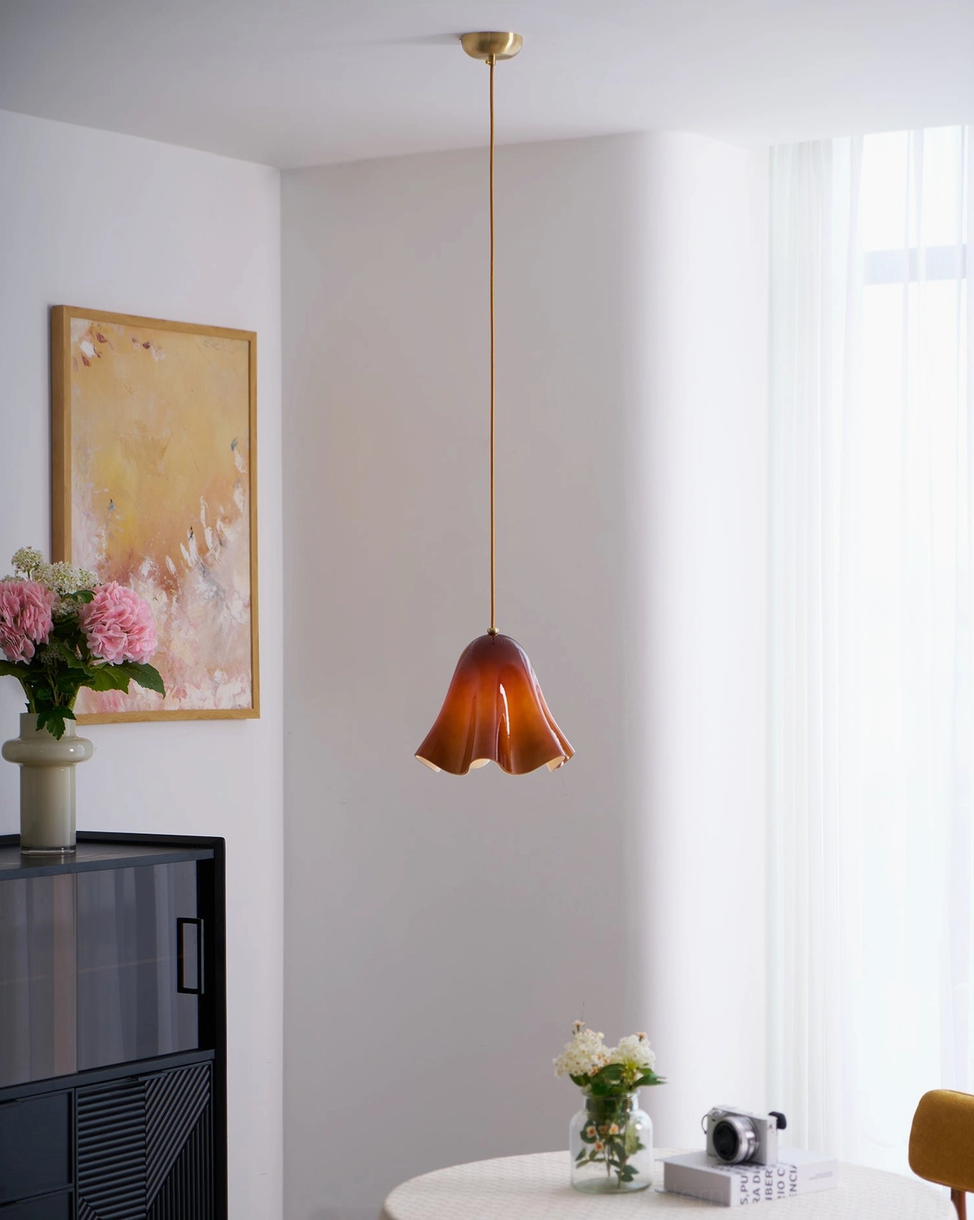 Vera sculptural glass pendant light soft focus artistic photography emphasizing ambiance