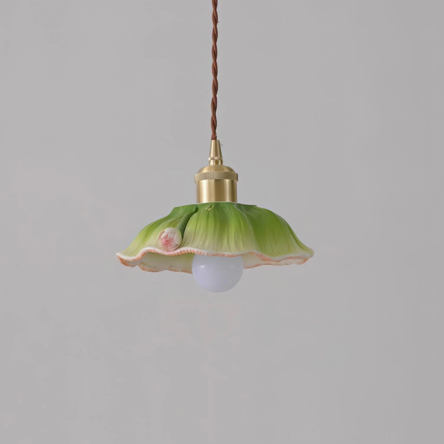 Verdant lotus pendant lamp frontal studio view with green ceramic shade, delicate pink floral decoration, and frosted white LED bulb