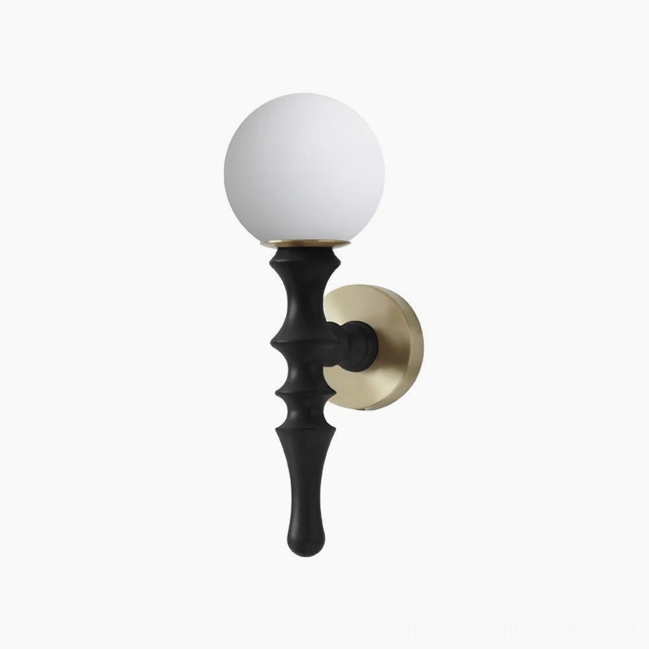 Vero wall sconce in black turned wood finish with brass mounting plate and frosted glass shade