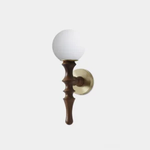 Vero mid-century modern wall sconce with turned wooden arm, frosted glass globe, and polished brass mounting plate on white background