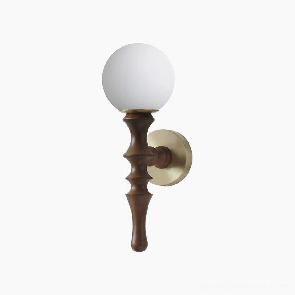 Vero wall sconce in walnut color finish with polished brass hardware and frosted glass globe studio view