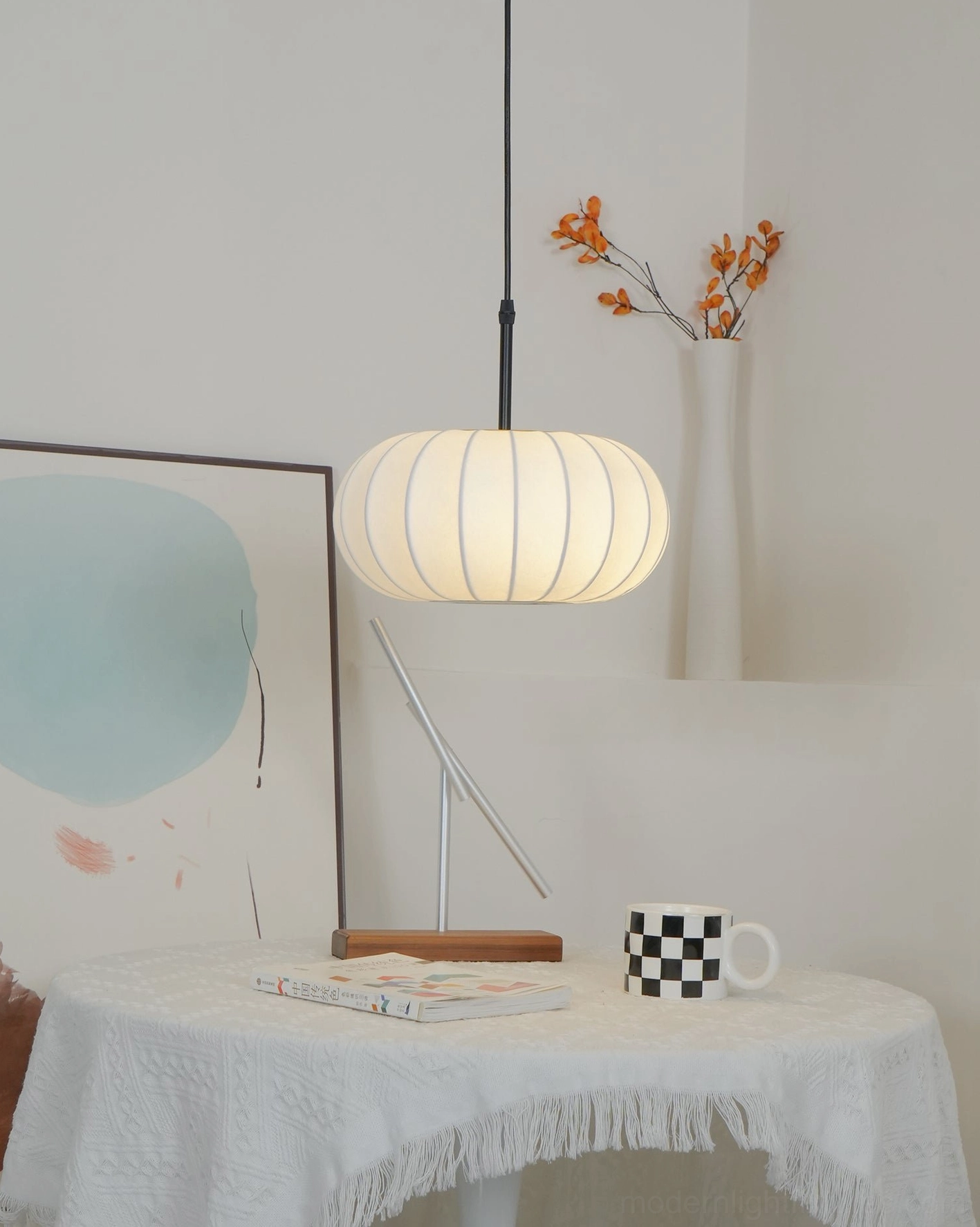 Verona fabric pendant light installed in contemporary dining room creating warm atmospheric glow over table setting