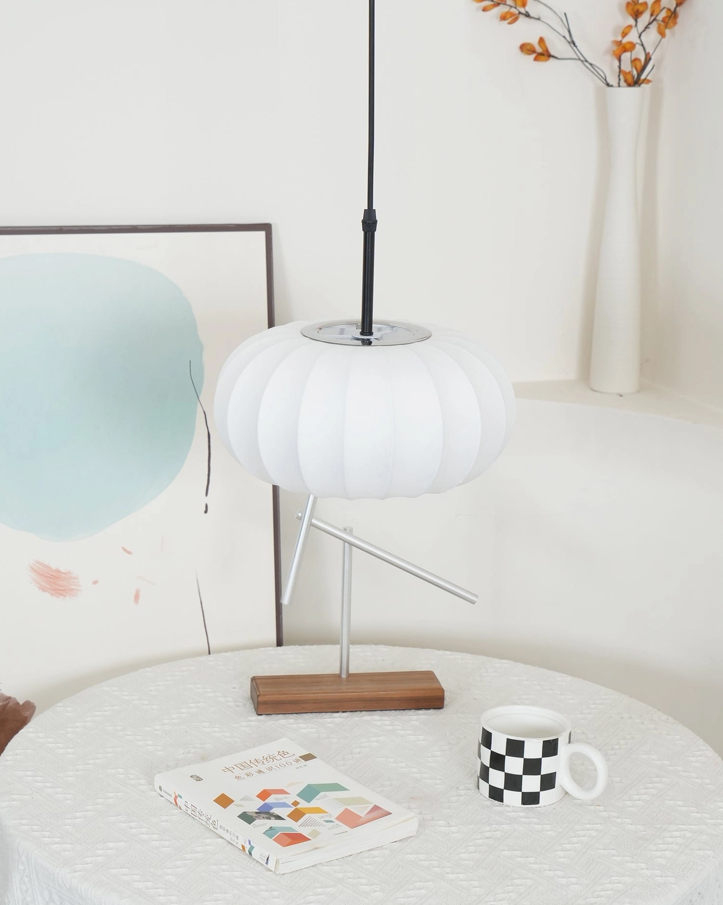 Verona modern pendant lamp detail showing fabric construction quality and warm beige coloring in studio lighting
