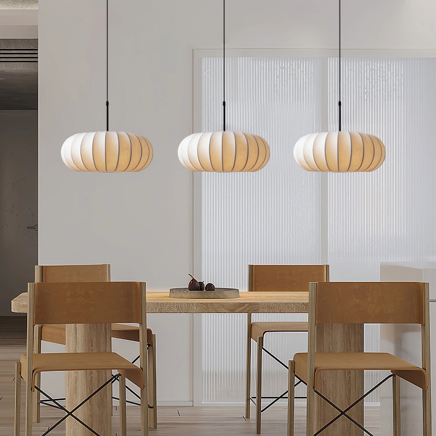 Three Verona pendant lights in modern dining room over wooden table, coordinated beige fabric shades creating rhythmic lighting composition