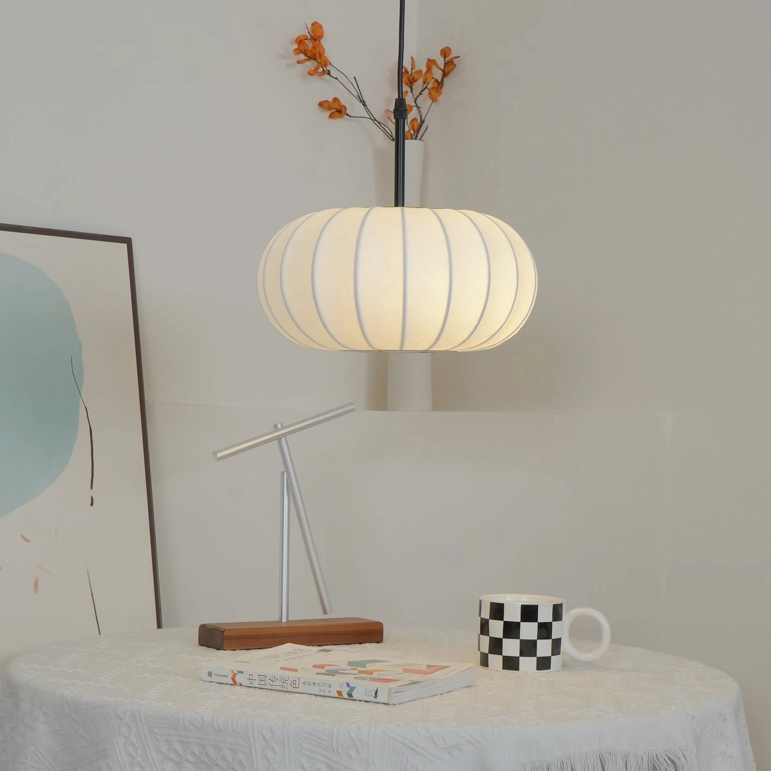 Verona pendant lamp front view showing clean fabric shade design and matte black metal suspension hardware in minimalist style
