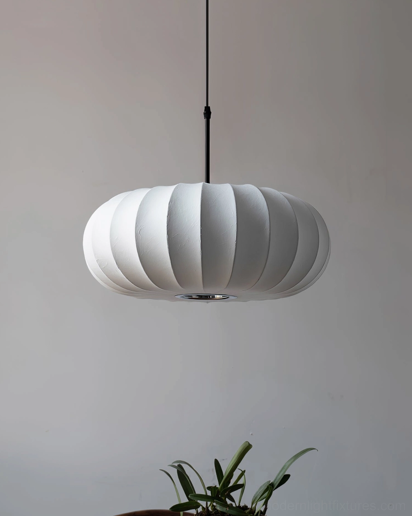 Verona pendant lamp detail showing warm fabric shade and clean metal frame lines in overhead view, modern pendant lighting