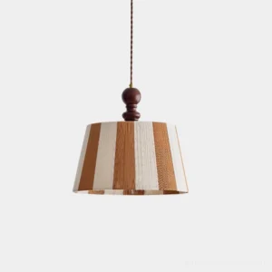 Vertical stripe drum pendant light with brown, off-white and wood-tone striping and dark wooden finial, front overhead studio view
