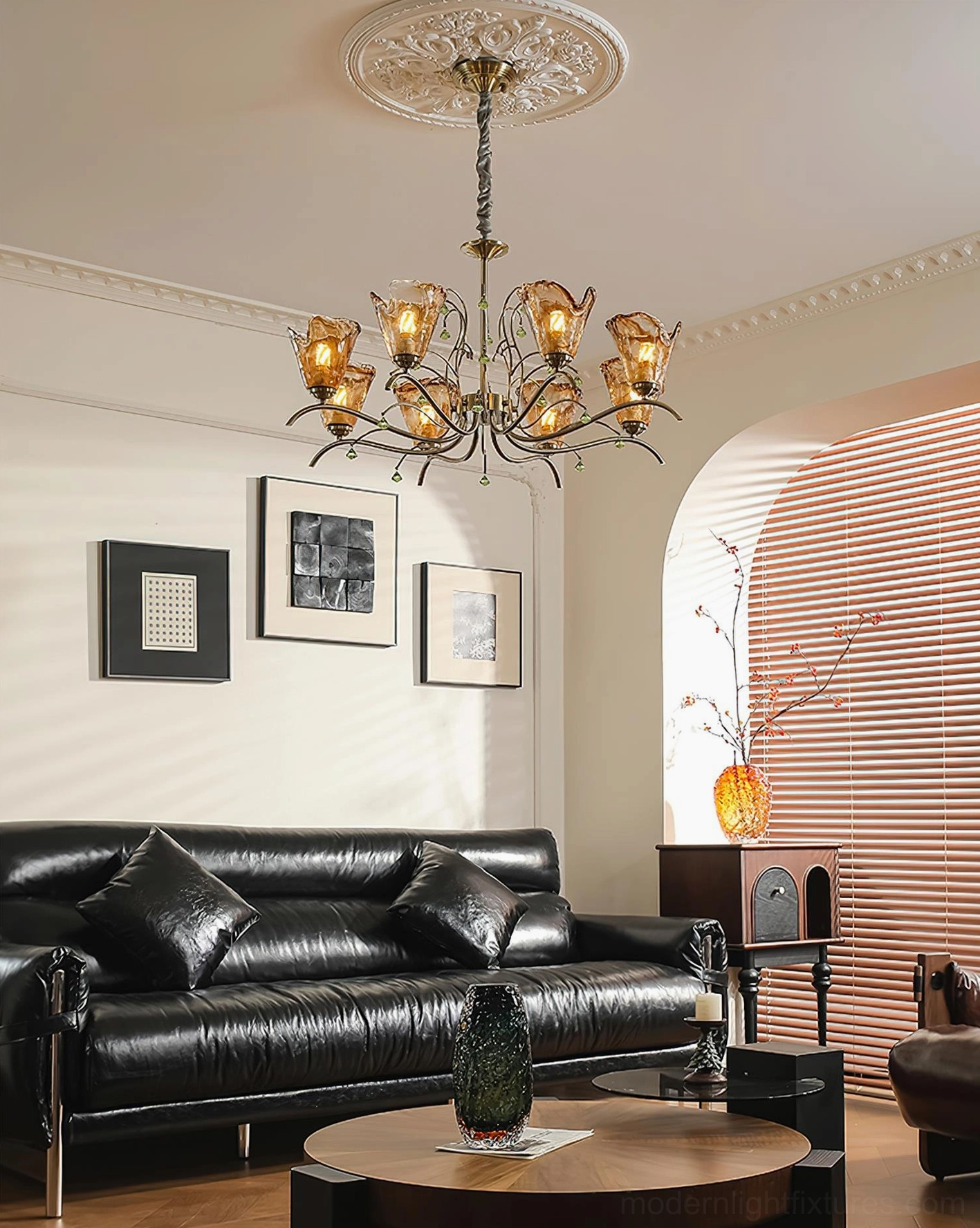 Vetraio hand-blown amber glass chandelier in retro vintage living room, wide panoramic room view with black leather furniture and warm lighting ambiance