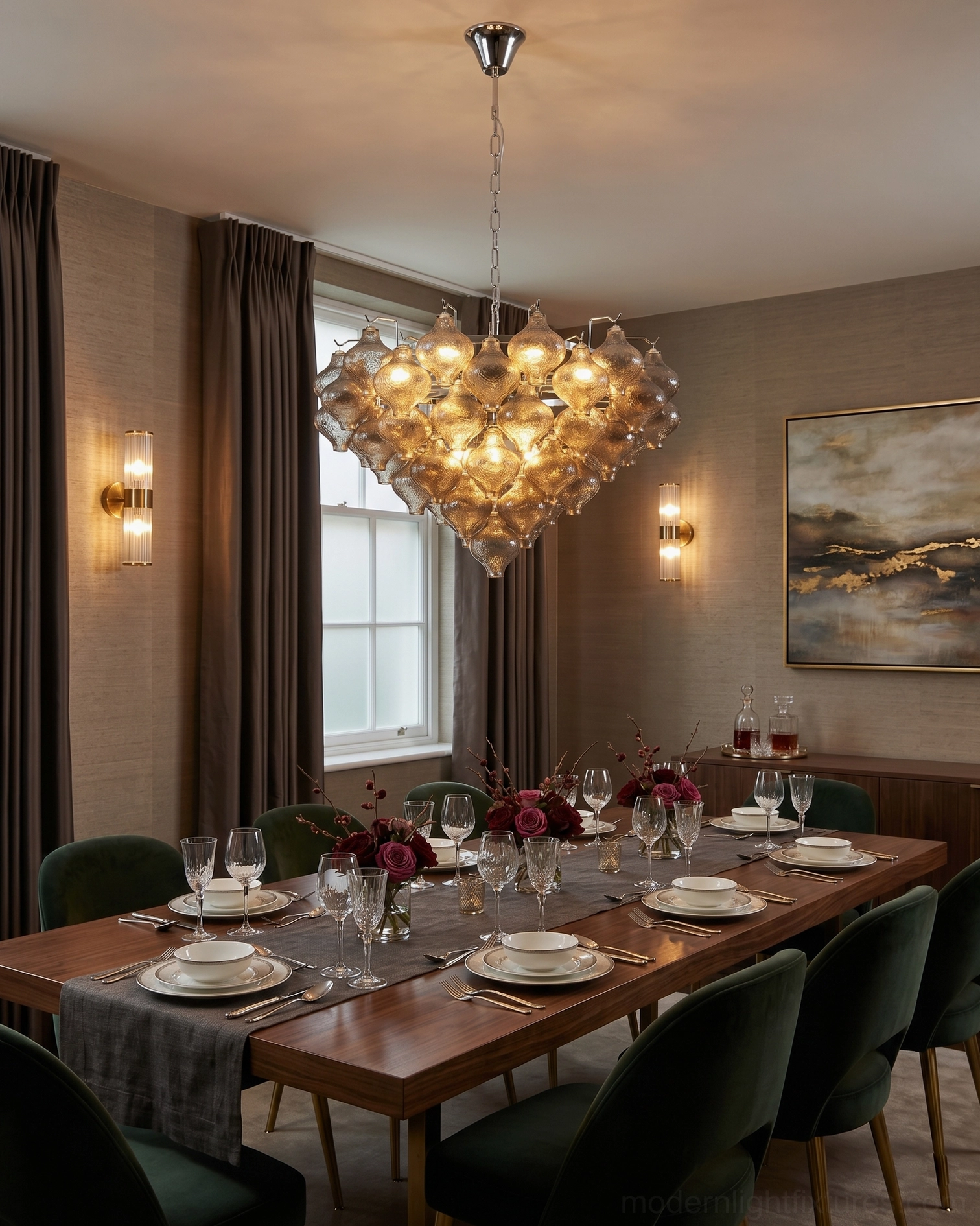 Vetrina amber tiered chandelier hanging over formal dining table in upscale dining room interior with warm light diffusion through hand-textured glass