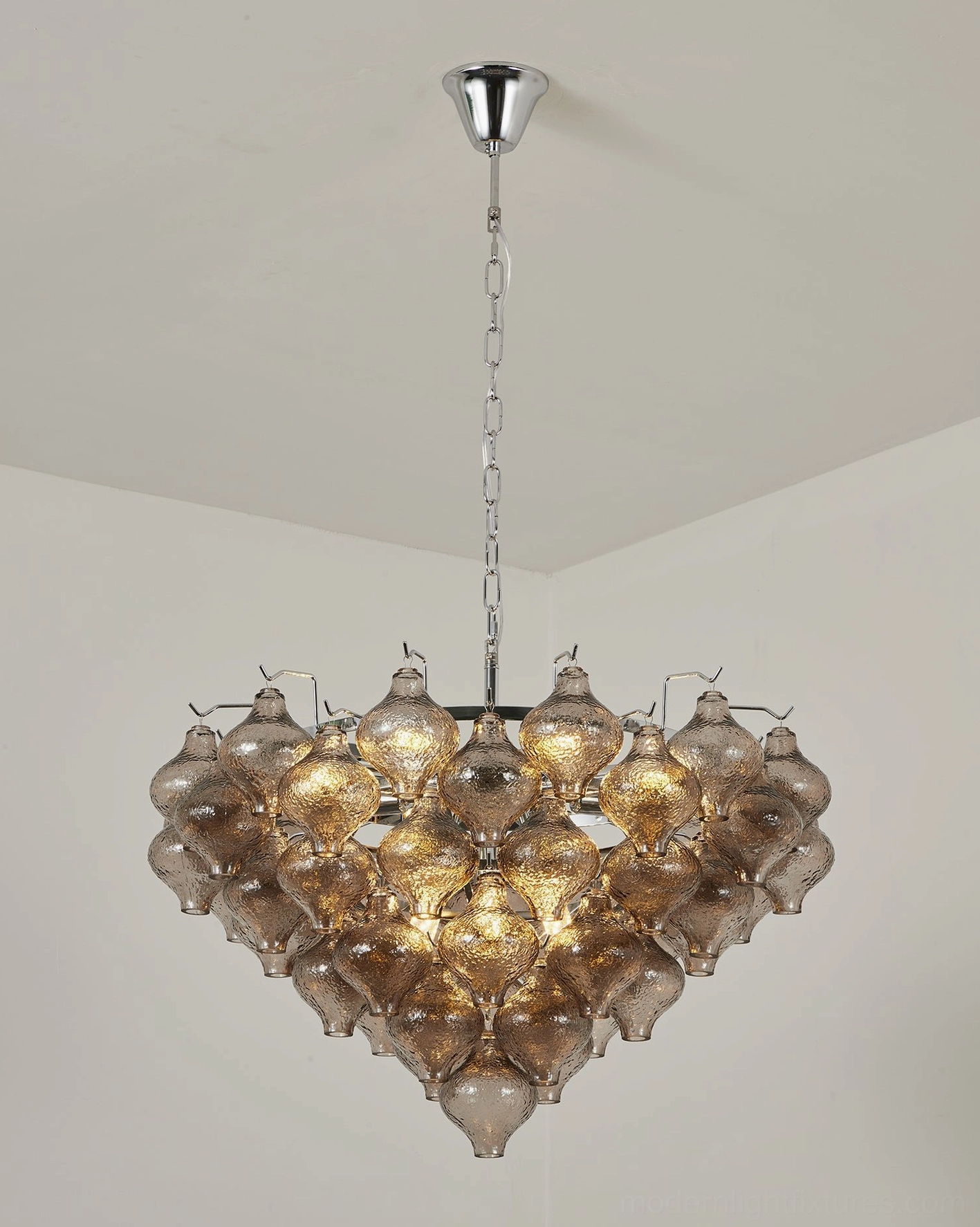 Vetrina large clear tiered tulip glass chandelier detail view showing layered onion-shaped hand-textured glass drops and inverted-cone silhouette