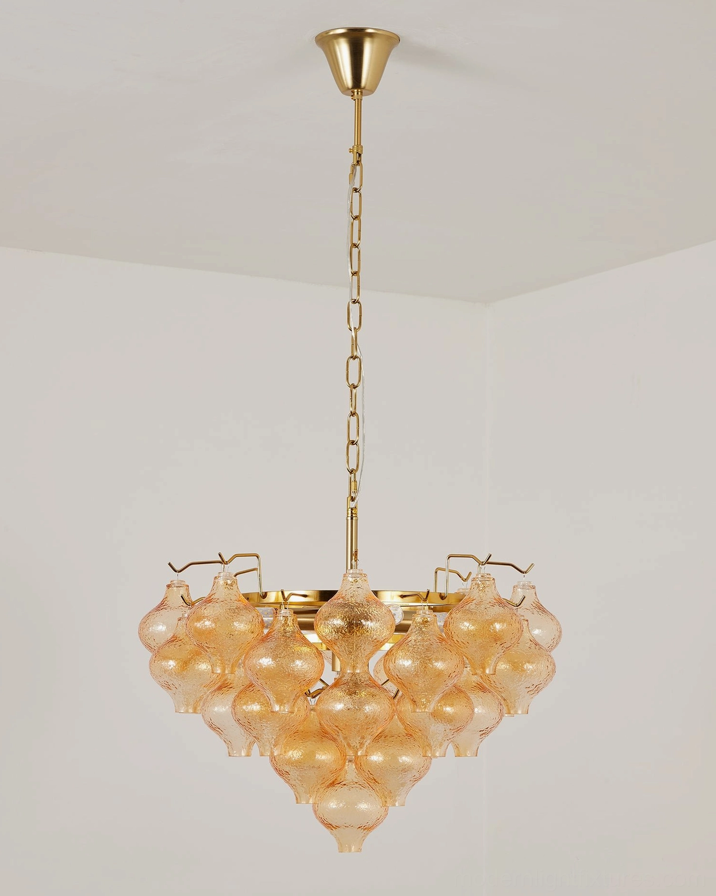 Vetrina medium amber tiered tulip glass chandelier front direct hanging view with heart-shaped glass drop cluster and polished brass metal fixtures
