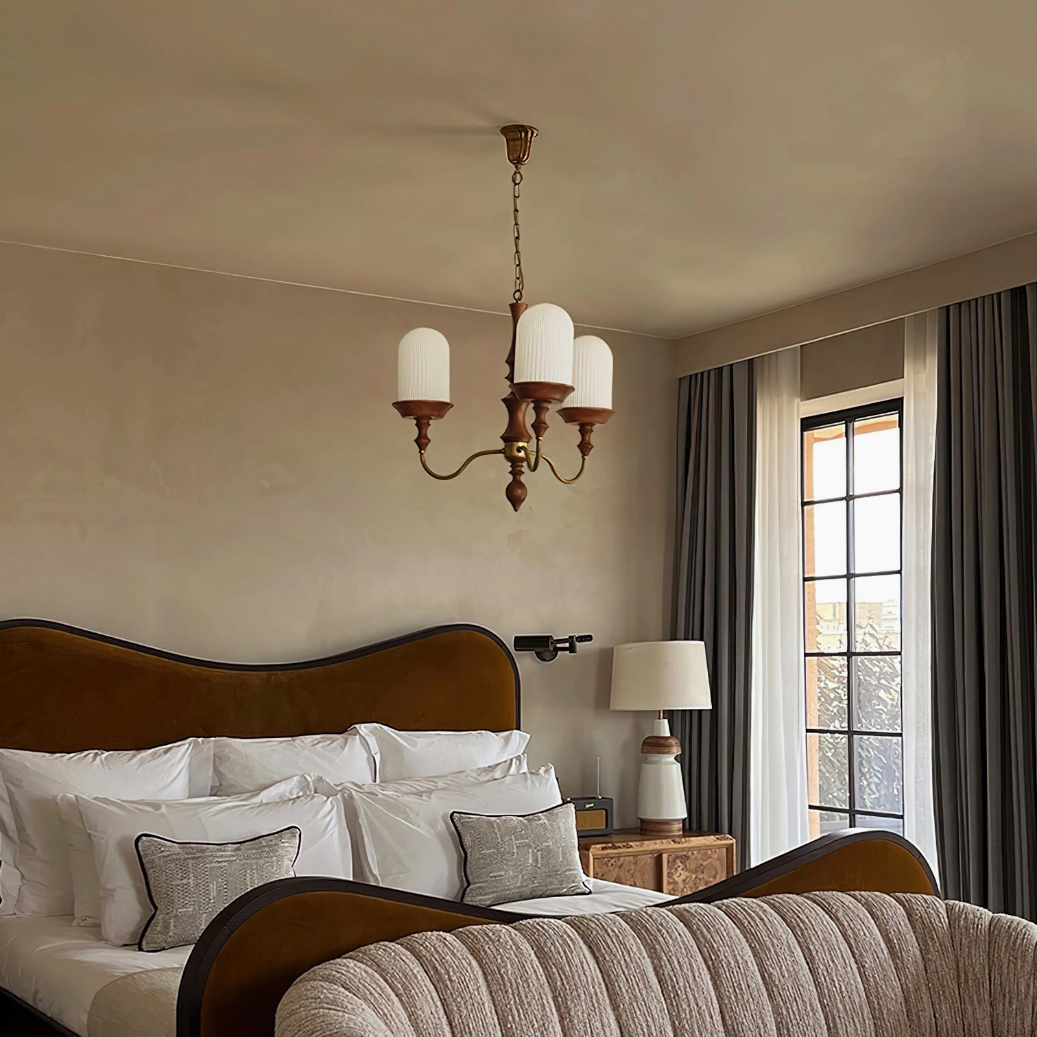 Veyra 3-arm vintage chandelier installed in modern master bedroom with warm lighting