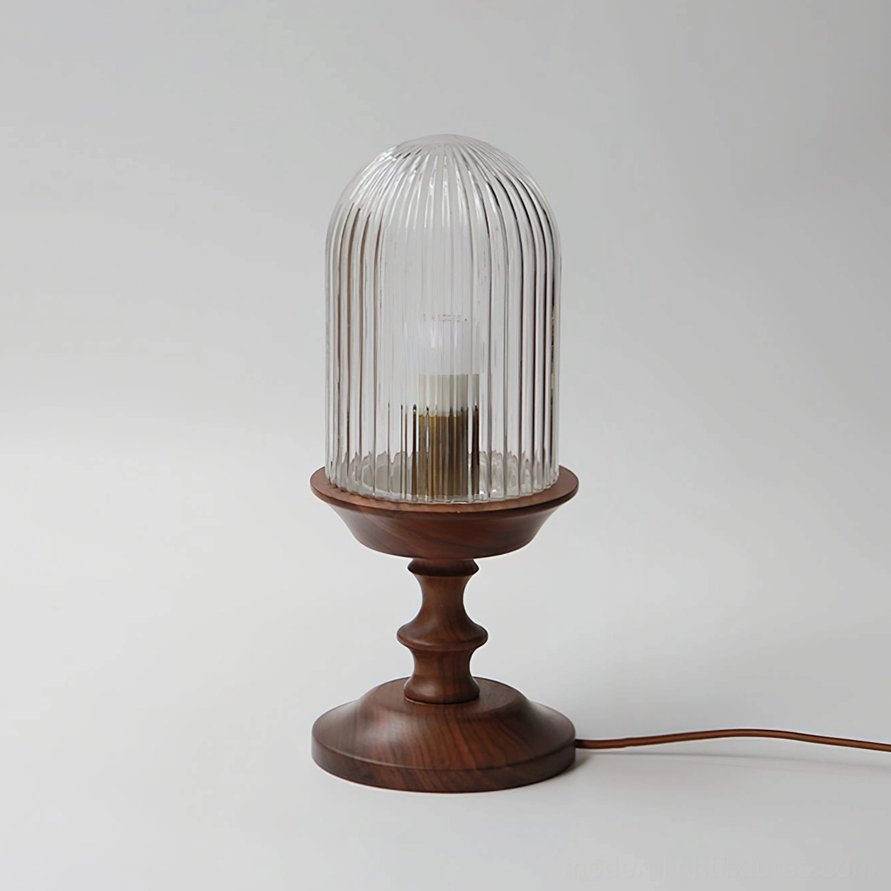 Clear ribbed glass dome table lamp exposed brass socket unlit mid-century modern design