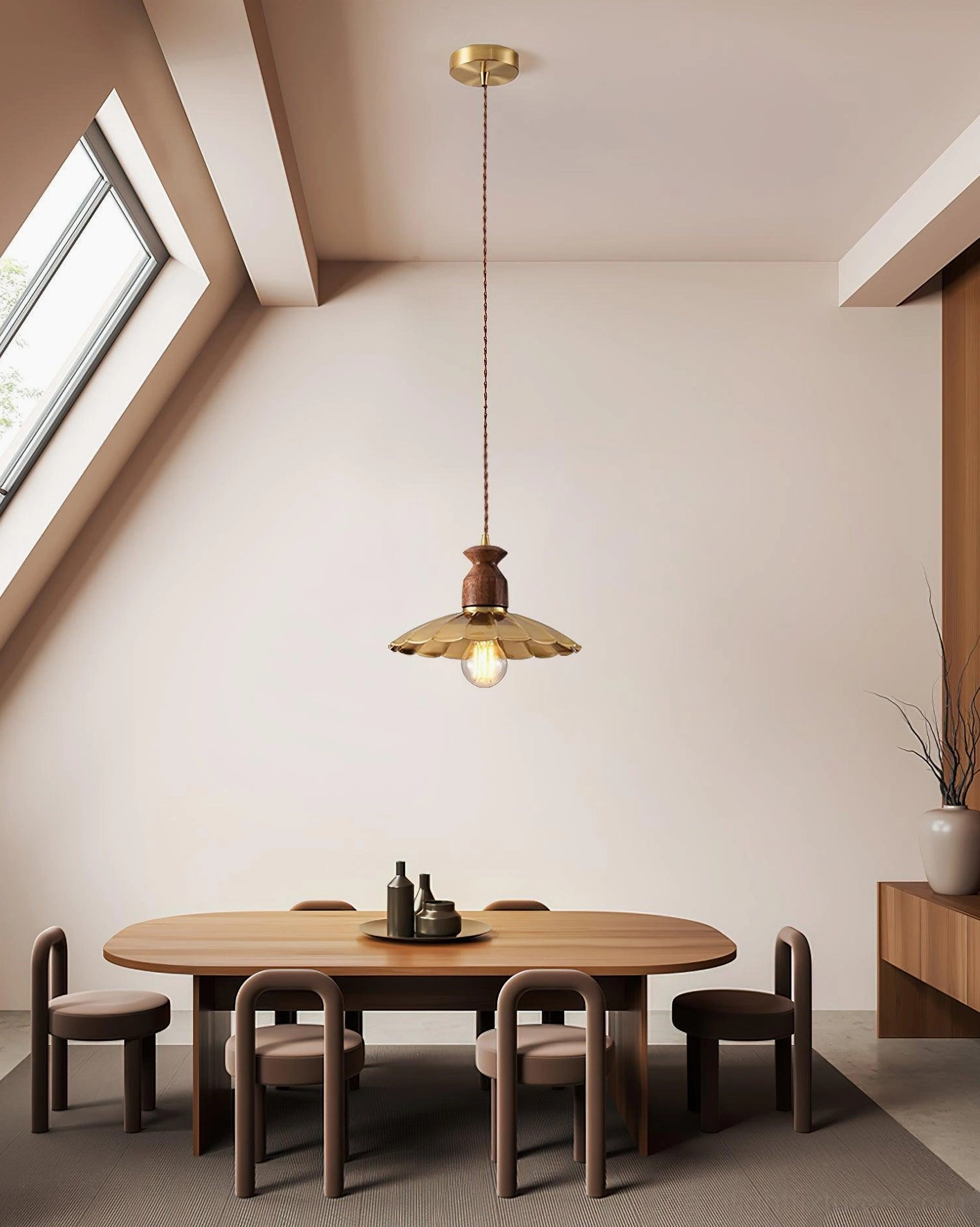 Viana scalloped pendant light high side angle view in attic dining room with round wooden table and skylight