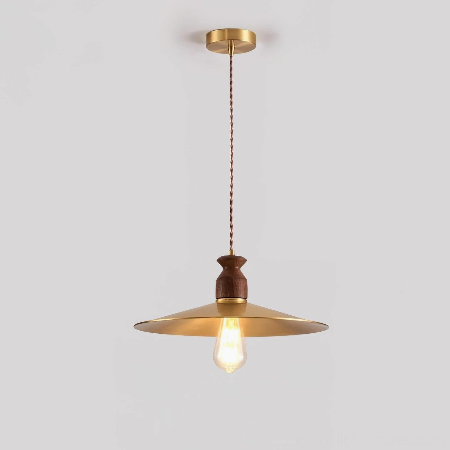 Viana brass petal pendant light close-up detail shot, showing scalloped shade craftsmanship and light diffusion