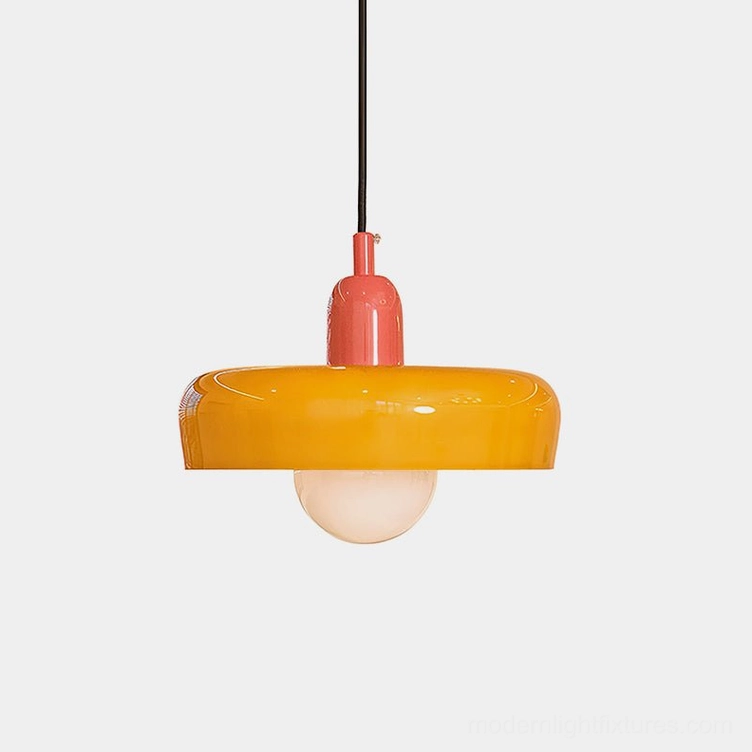 Vibrant orange frosted glass donut pendant light with pink metal holder, studio close-up showing geometric silhouette and warm glow