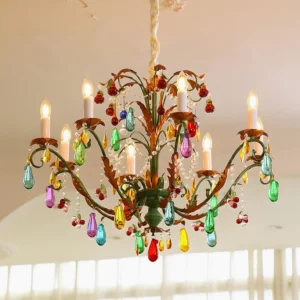 8-head Vibranza chandelier upward angle view showing cascading glass prisms and lit candle bulbs
