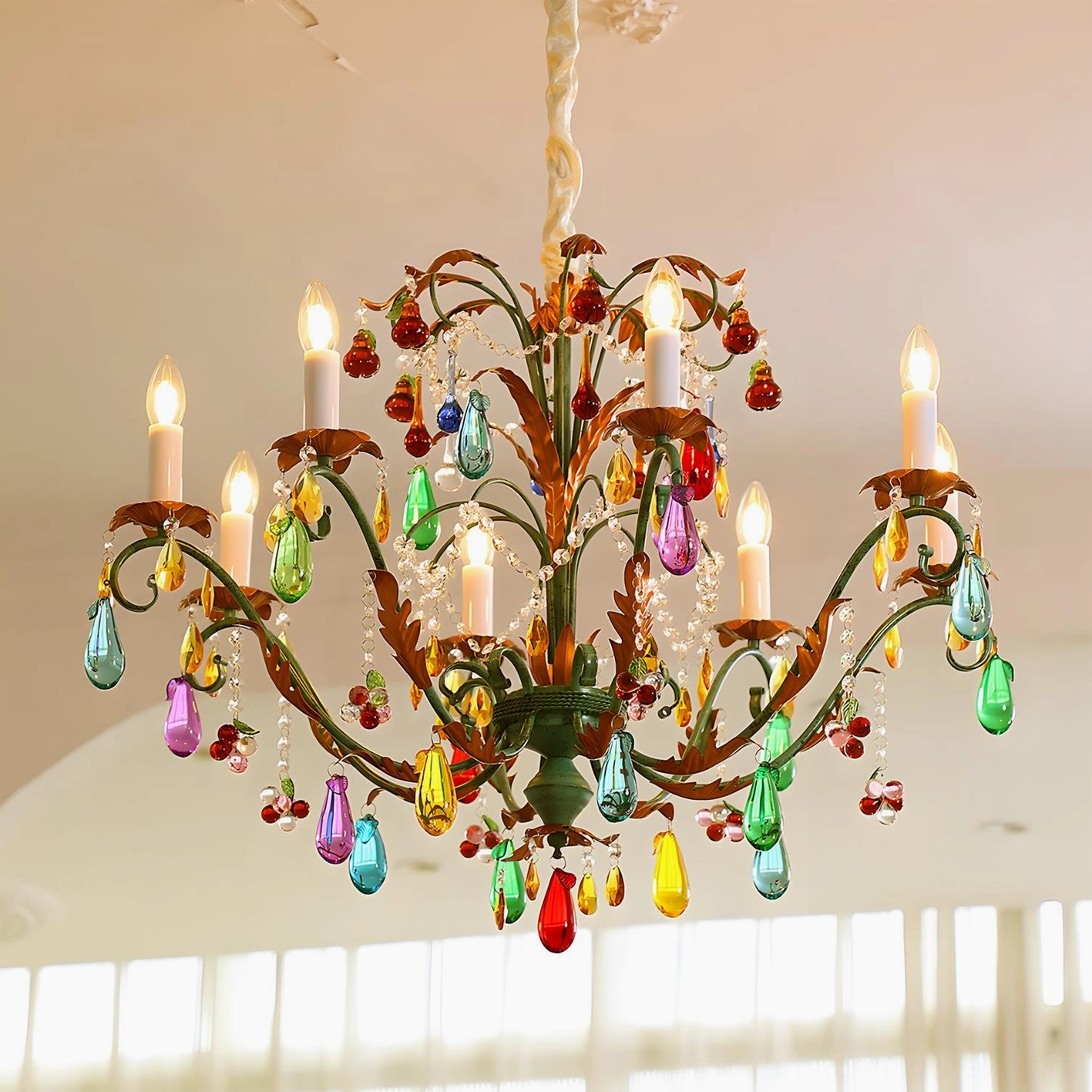 8-head Vibranza chandelier upward angle view showing cascading glass prisms and lit candle bulbs