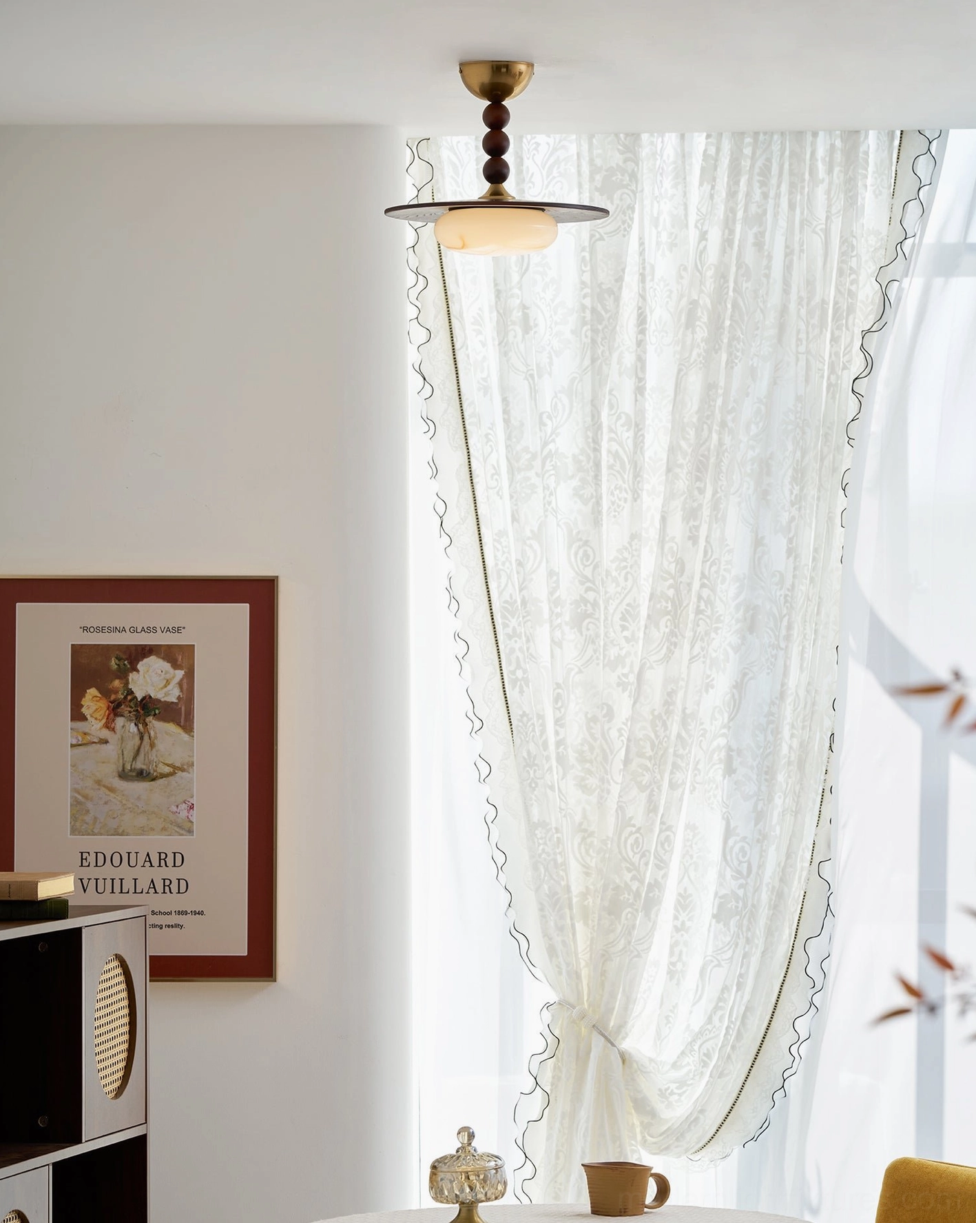 Vicenza warm white ceiling fixture in dining room with wooden table setting
