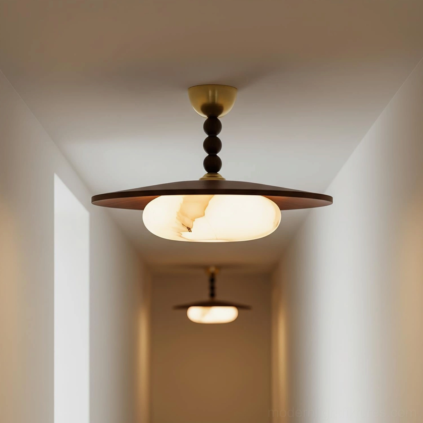 Vicenza damp-rated ceiling light fixture illuminating narrow hallway corridor