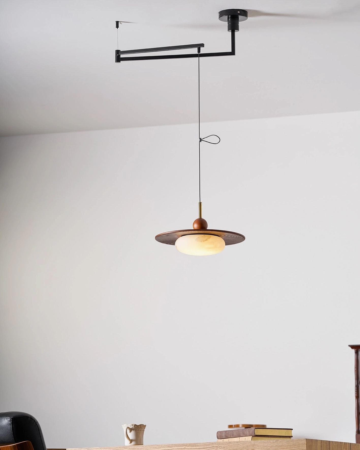 Modern swing arm pendant light architectural view of articulating mechanism and design proportions