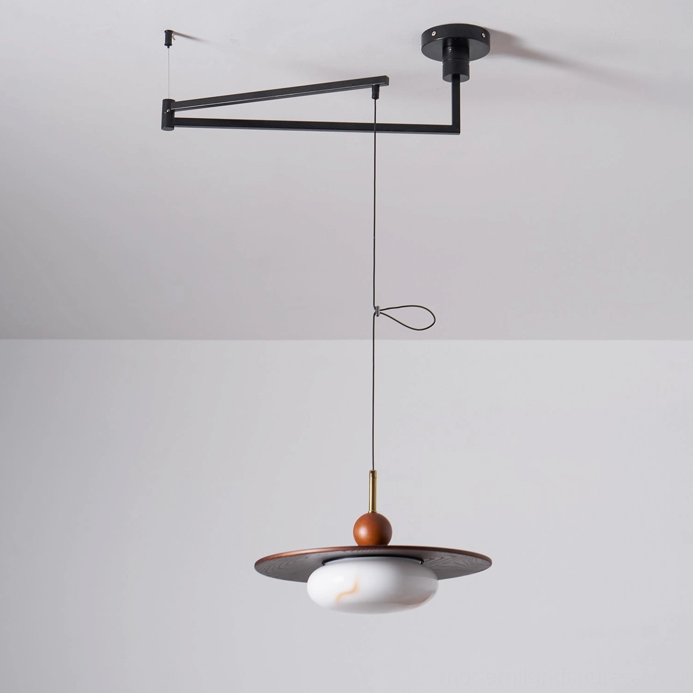 Vicenza swing arm pendant fixture showing warm white 3000K color temperature and ambient glow quality