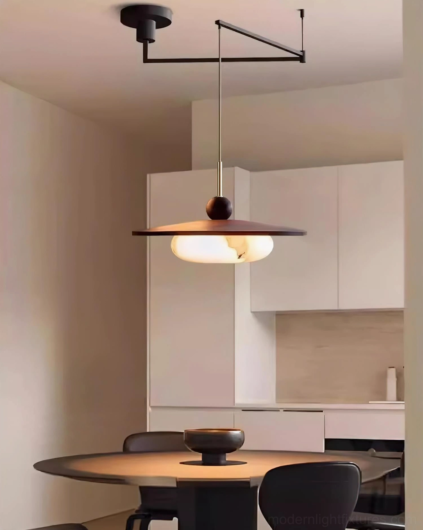 Modern swing arm pendant lamp displaying warm white LED light output and glass diffuser performance