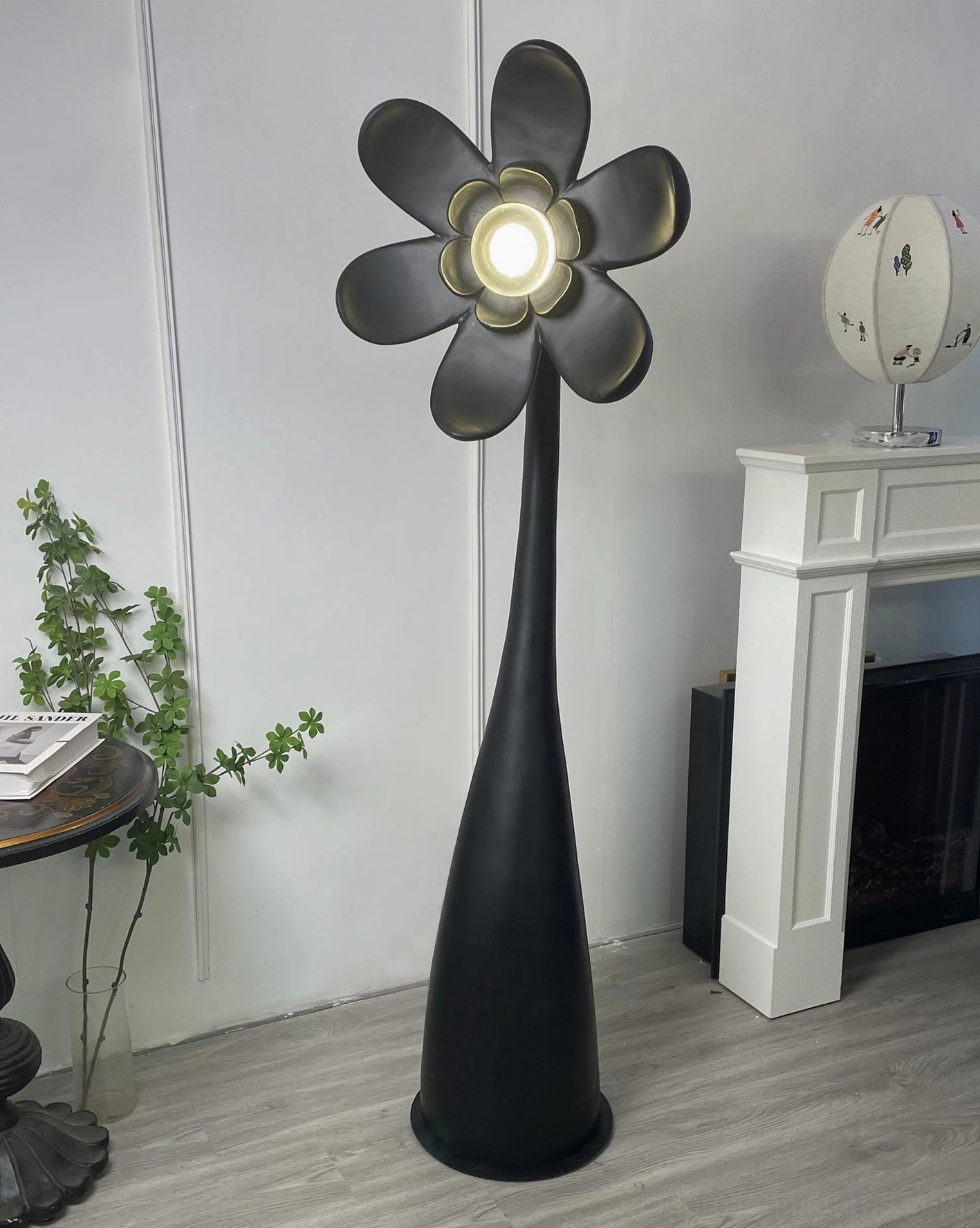 Vicenzio black matte floor lamp creating sculptural focal point in minimalist modern room