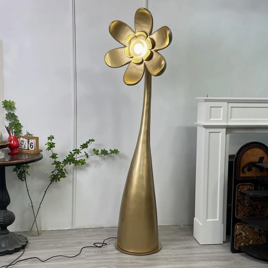 Vicenzio gold flower floor lamp in vintage interior - tall curved stem with illuminated petal design