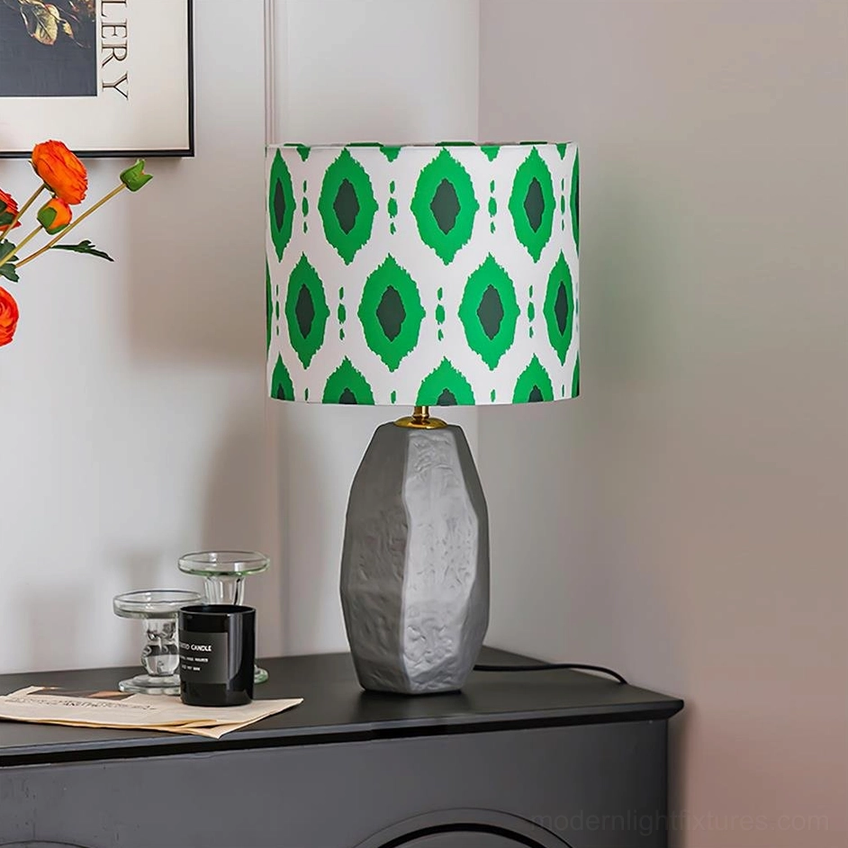 Vico table lamp with grey textured ceramic base and green geometric diamond ikat fabric shade, contemporary bohemian design